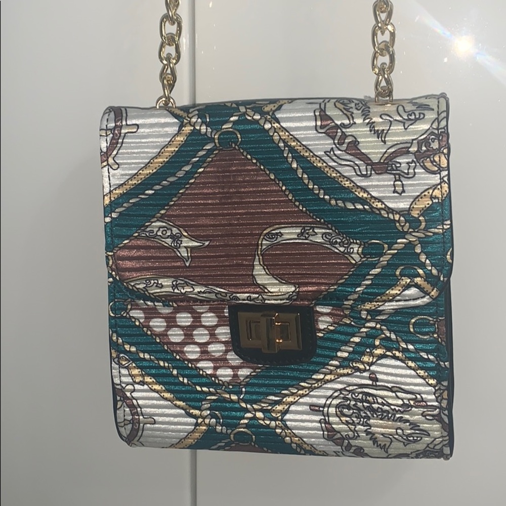 Fashionable purse with green gold and tan colors